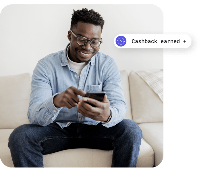 man earning cashback on device man earning cashback on device