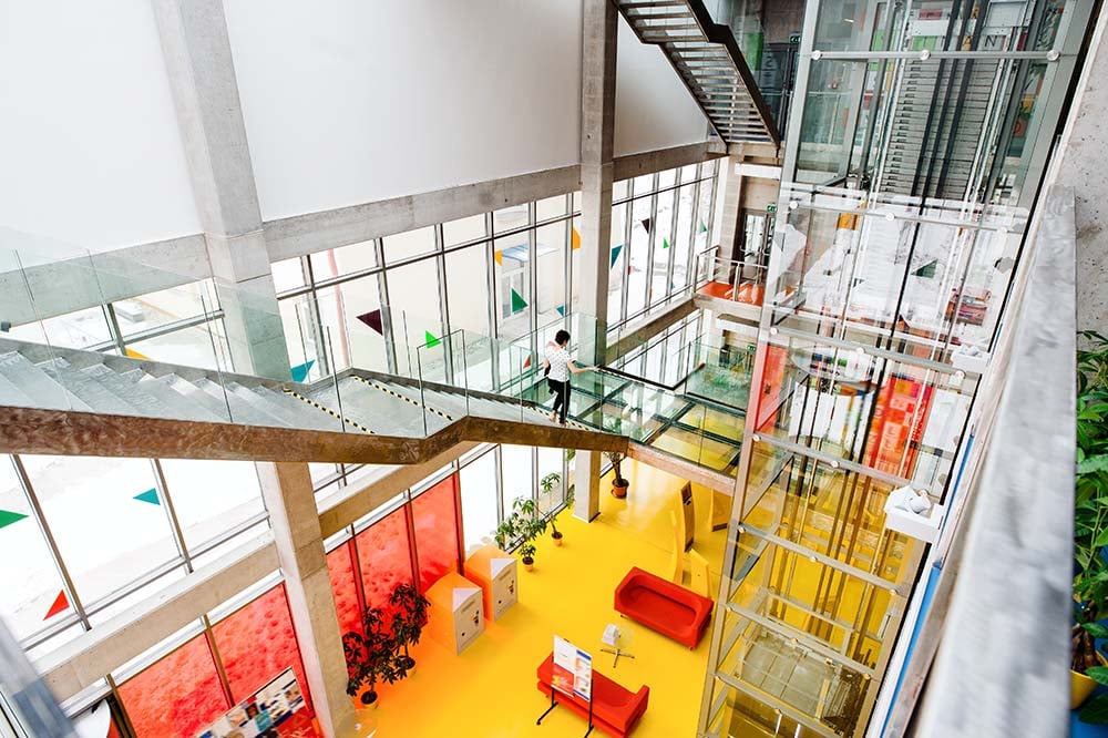 woman-walks-on-staircase-in-bright-modern-building-2026-03-10-02-07-24-utc