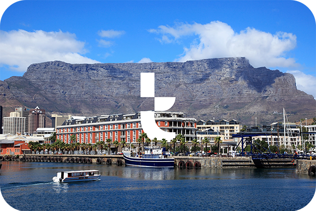 The Tillo T sits on a mountainous background, with water in the forefront